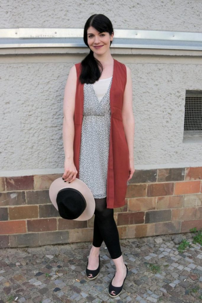 long vest and fedora