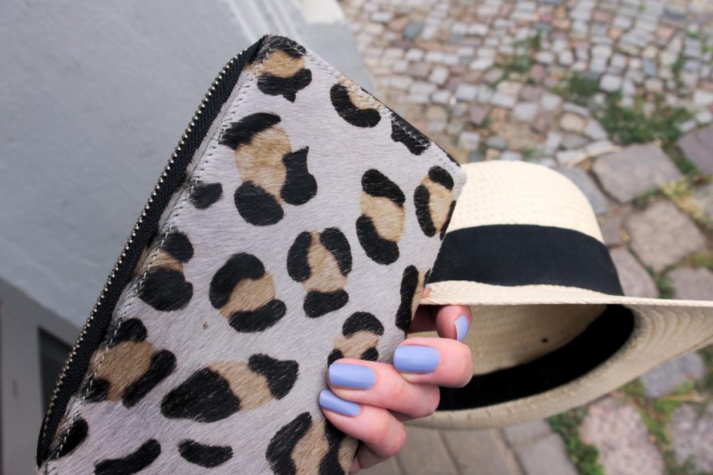 leopard clutch detail and straw hat