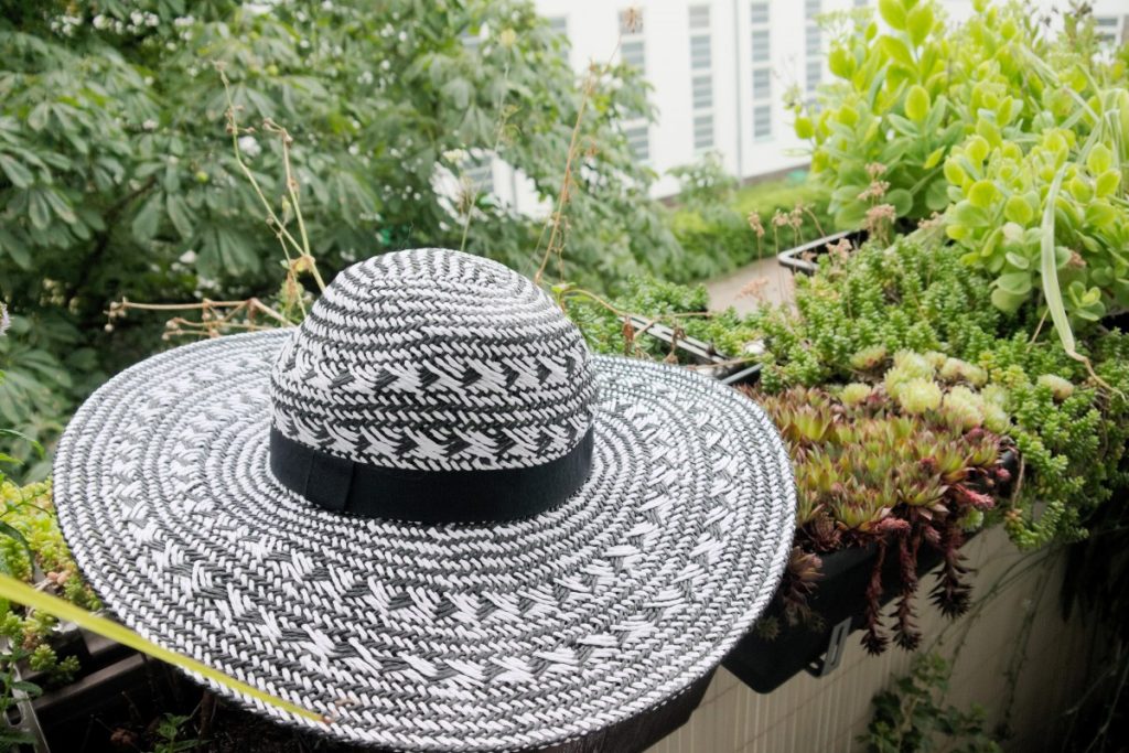 white cotton dress and straw hat