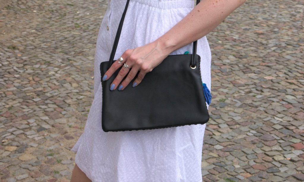 white cotton dress and tassel bag