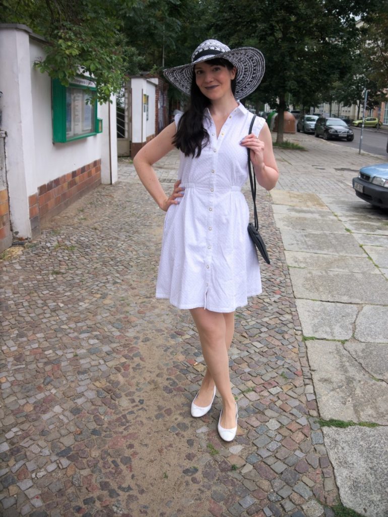 white cotton dress and straw hat