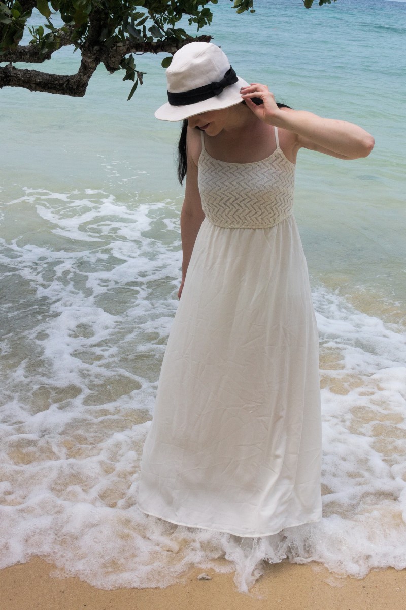 white maxi dress on white beach