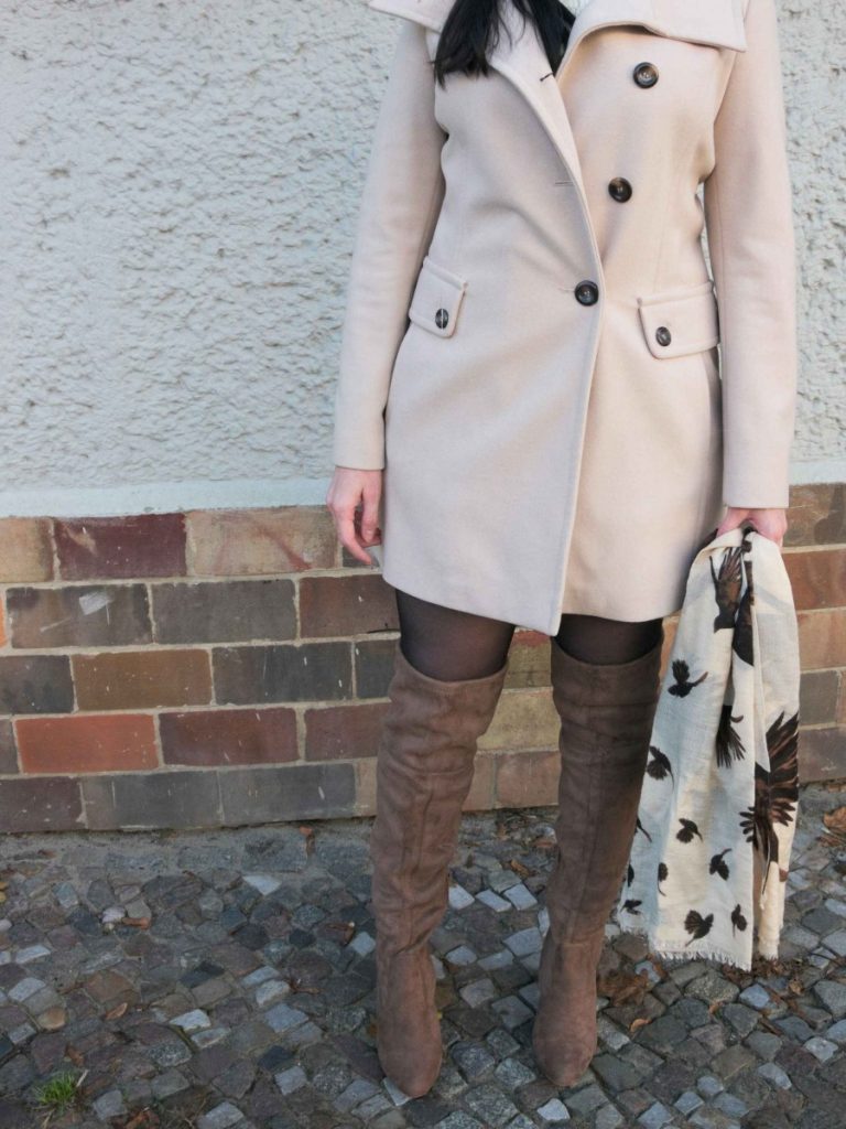 khaki OTK boots and cream coat