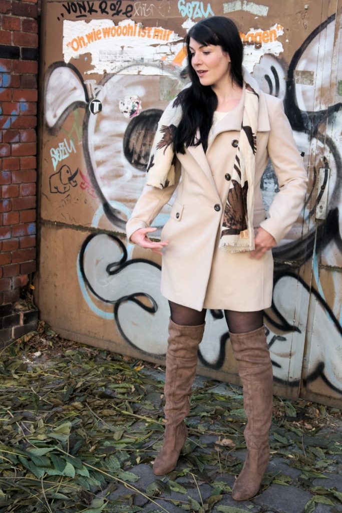 khaki over the knee boots and cream coat