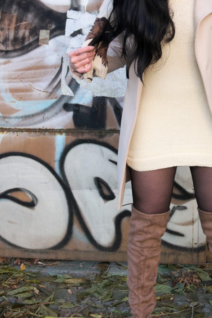 khaki over the knee boots and cream coat