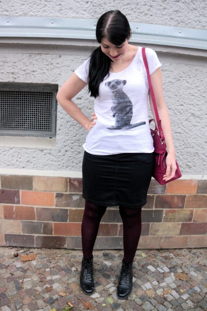 casual winter work wear outfit with pixel meerkat shirt and ostrich bag