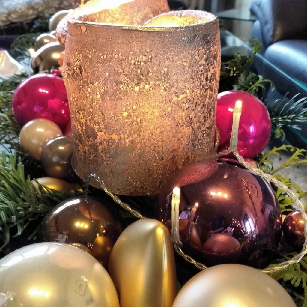 golden candle and christmas ornaments