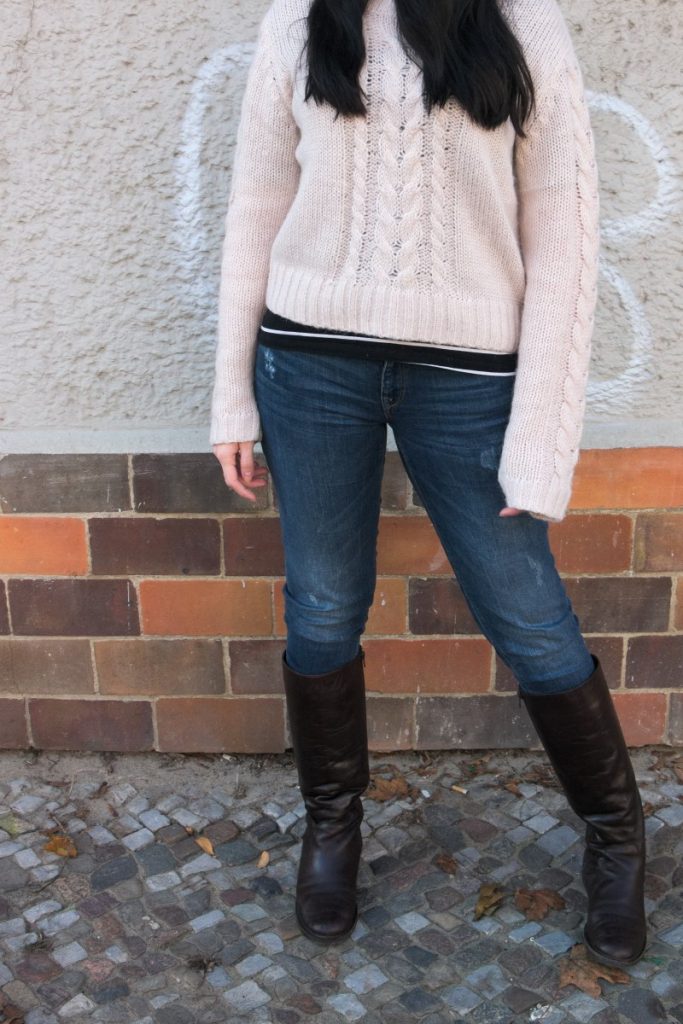 cable sweater and brown leather boots