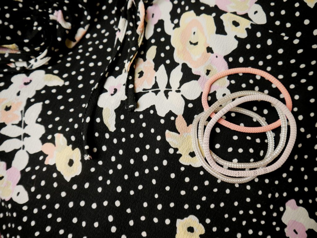 floral dress closeup with H&M metal bracelets