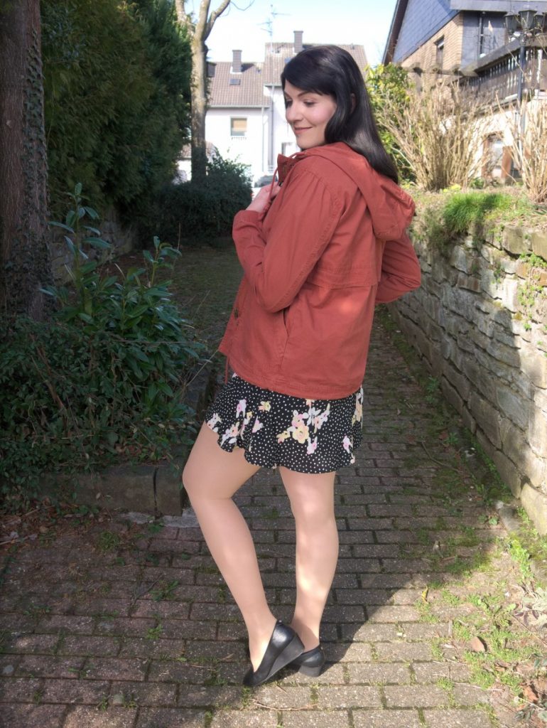 short black and white dots dress with floral print and transitional light cotton jacket