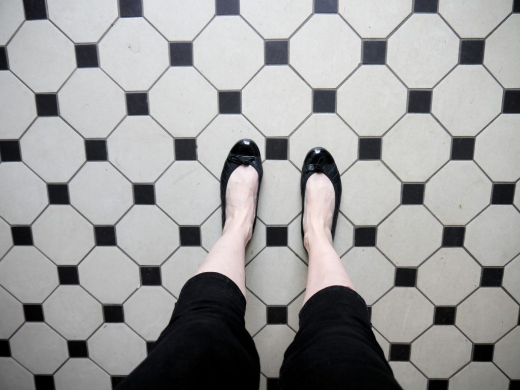 black and white tiles with ballerina flats and capri trousers